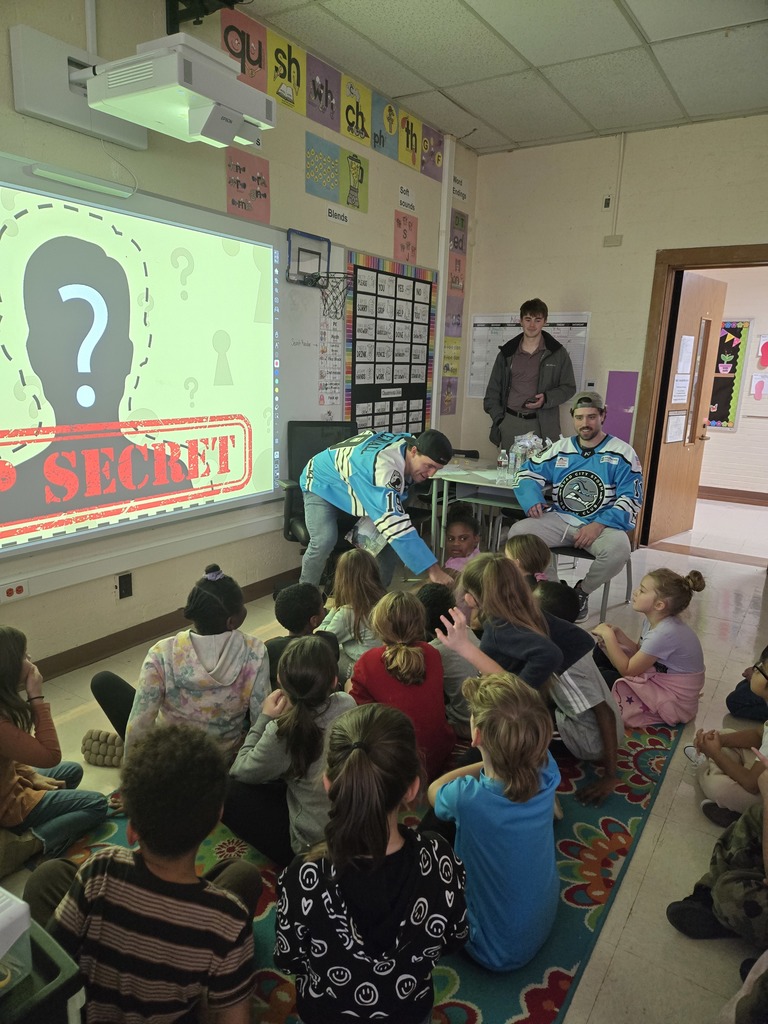 Player high fiving student