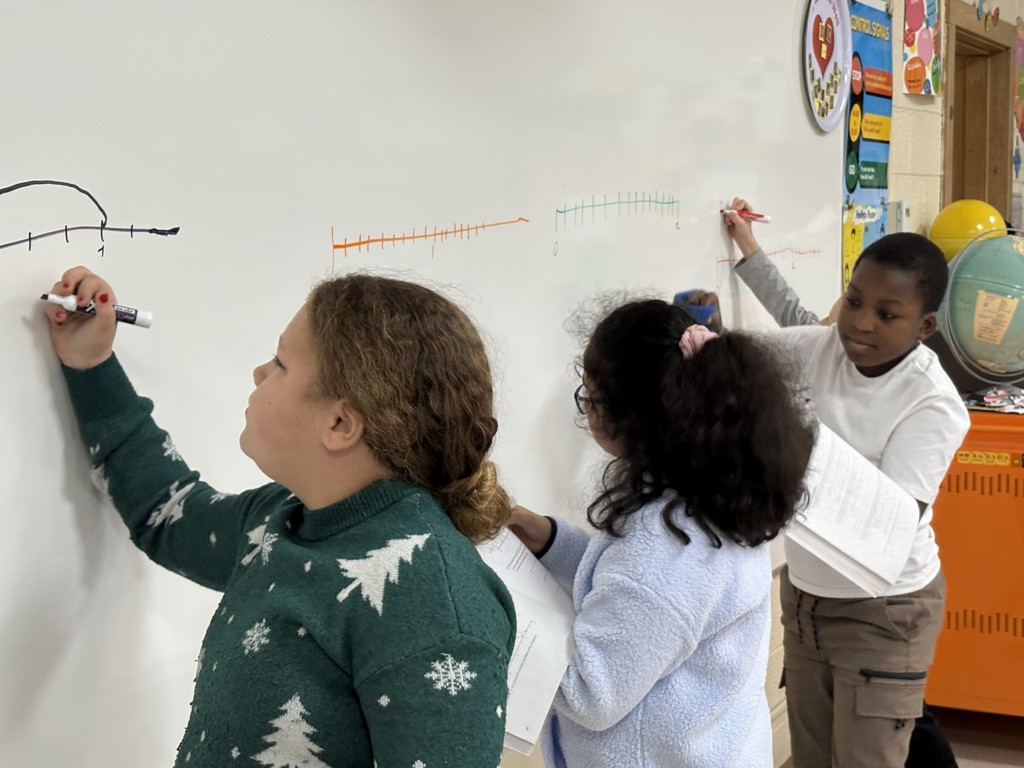 Students working on the whiteboard