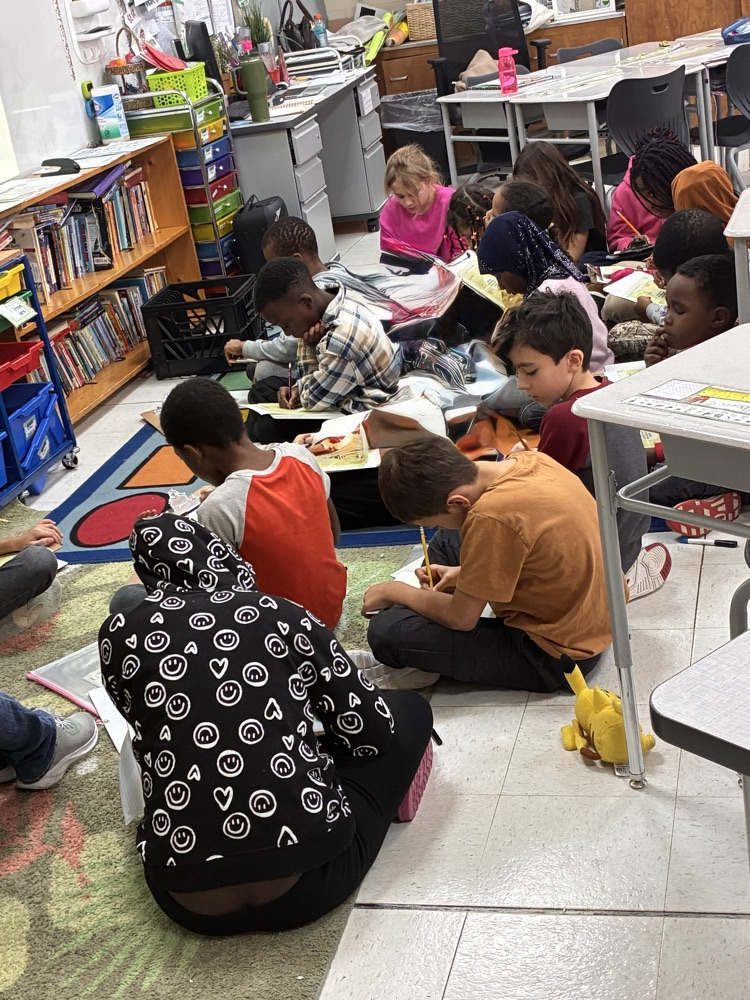 students working hard on division problems.