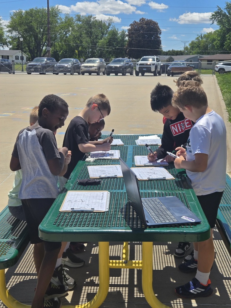 Students playing Phonics bingo outside!