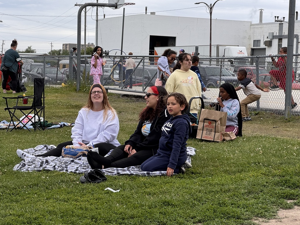 Family enjoying lunch on the lawn