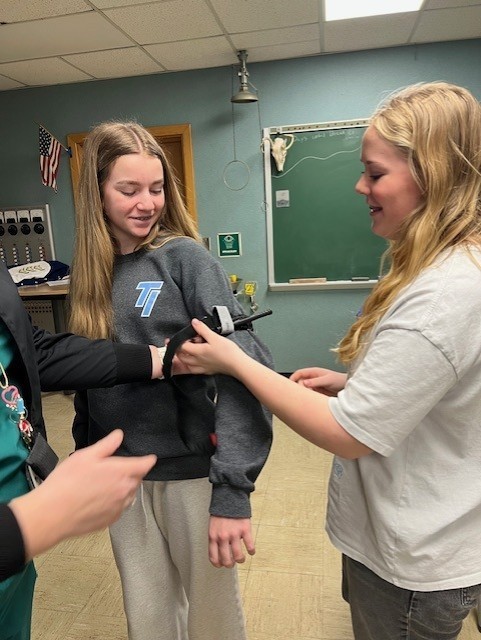 one student taking another students blood pressure