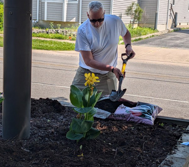Superintendent Steve Planting Flowers