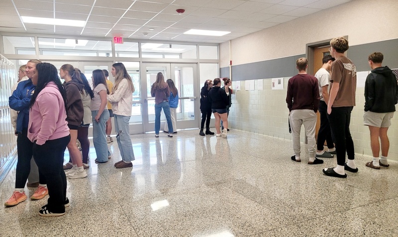 students gather in a hallway