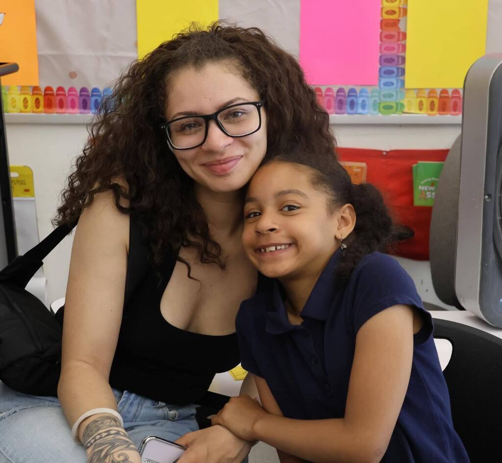 Mother and daughter on bring your parent to school day