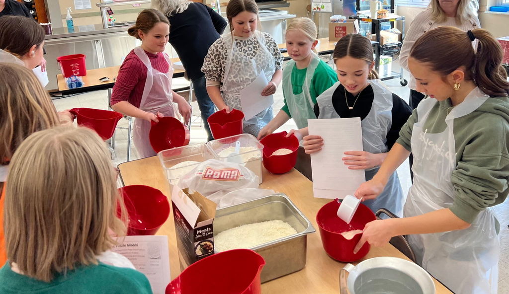 students cooking gnocchi
