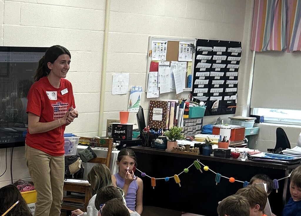 miss ivy speaking to students