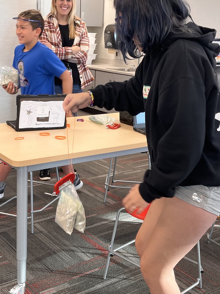 A group of students together to test materials