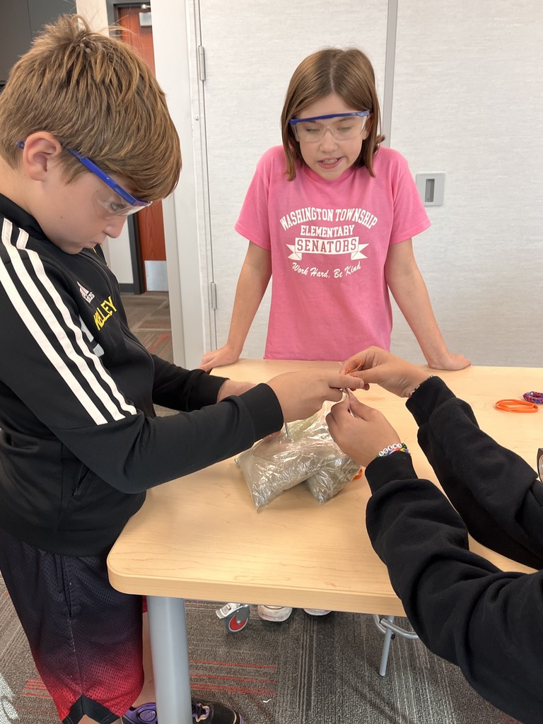 A group of students together to test materials
