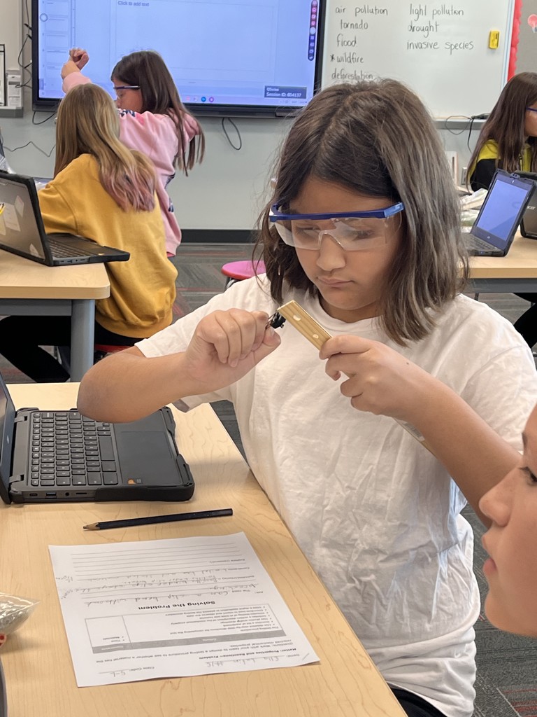 A student measuring materials