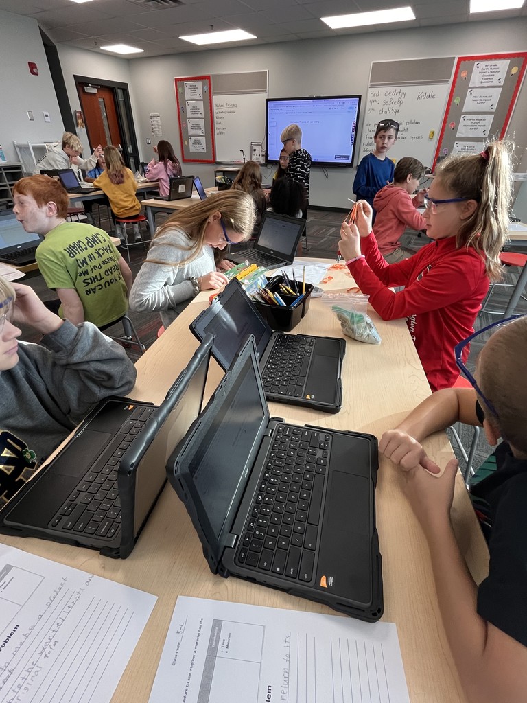 A group of students together to test materials