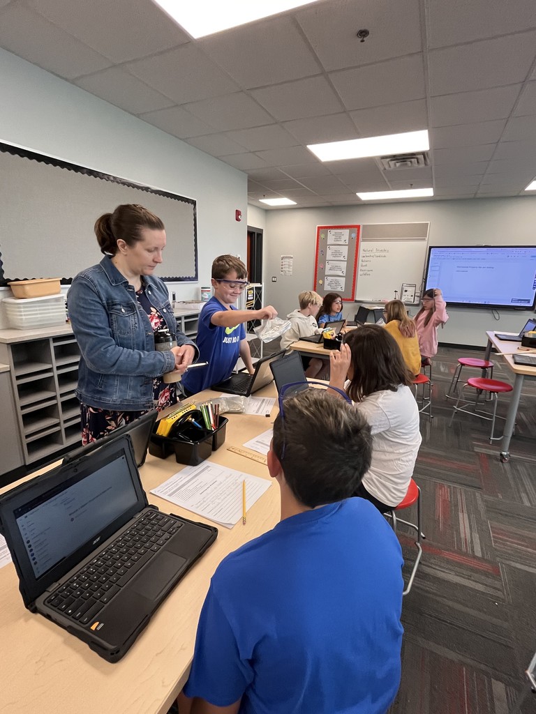 A group of students together to test materials