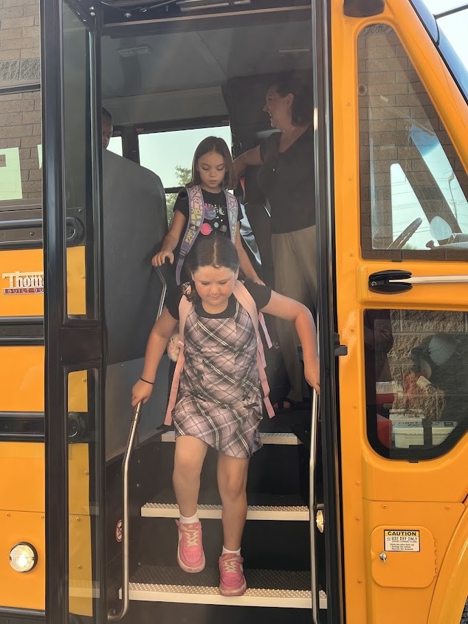 Kids getting off bus