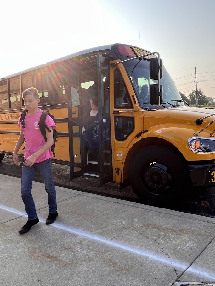 Teens getting off bus