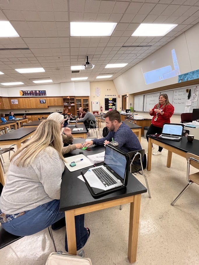Teachers listening to presenter