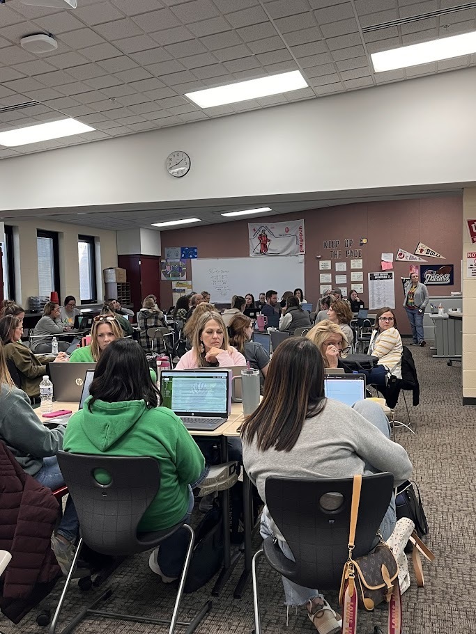 Teachers listening to presenter
