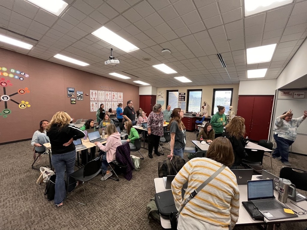 Teachers listening to presenter