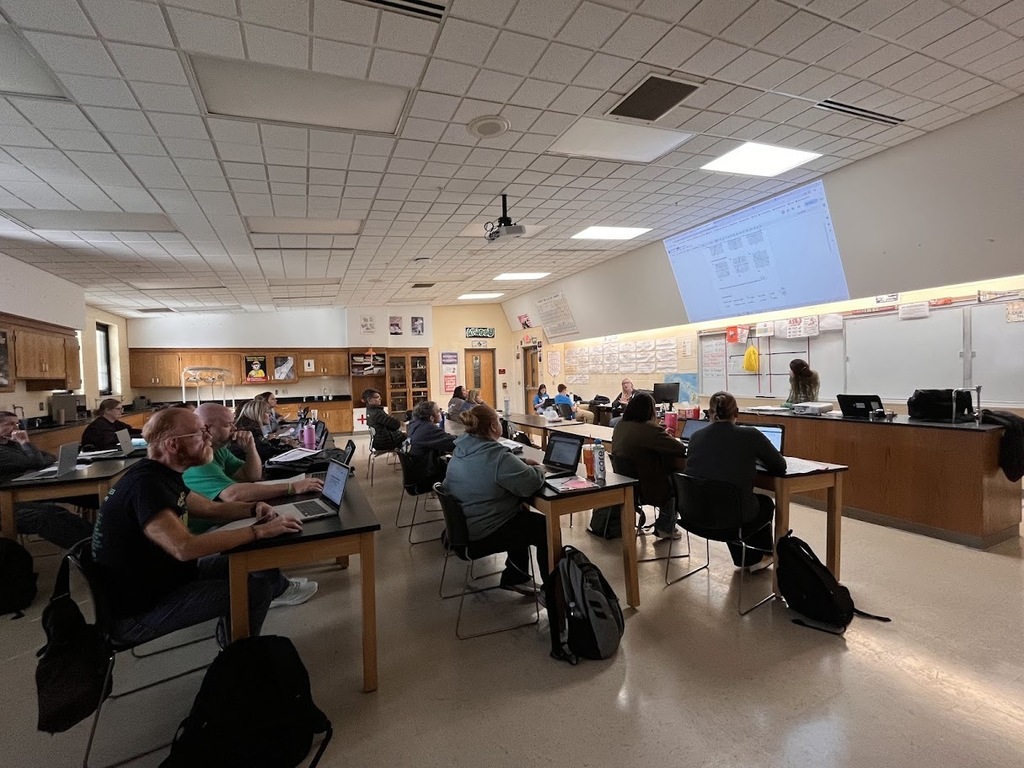 Teachers listening to presenter