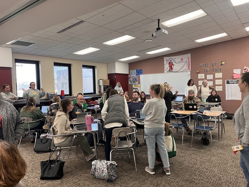 Teachers listening to presenter
