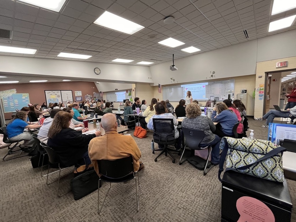 Teachers listening to presenter