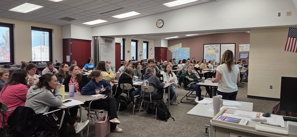 Teachers listening to presenter