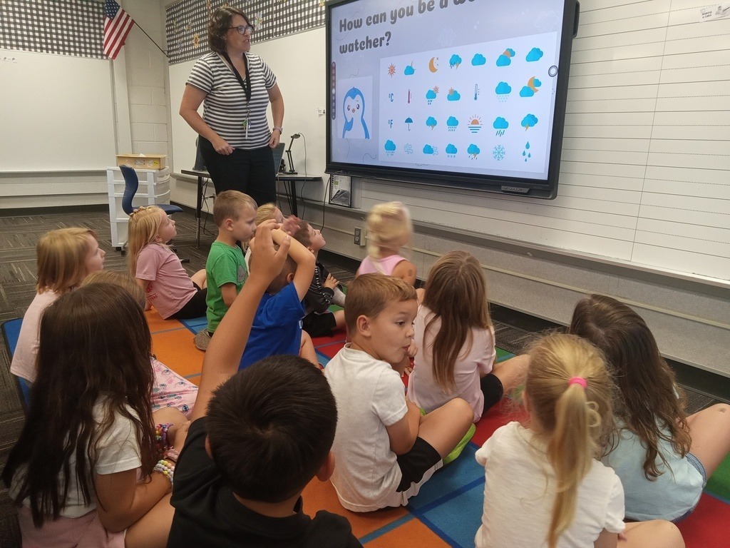 STEM teacher presenting to elementary students