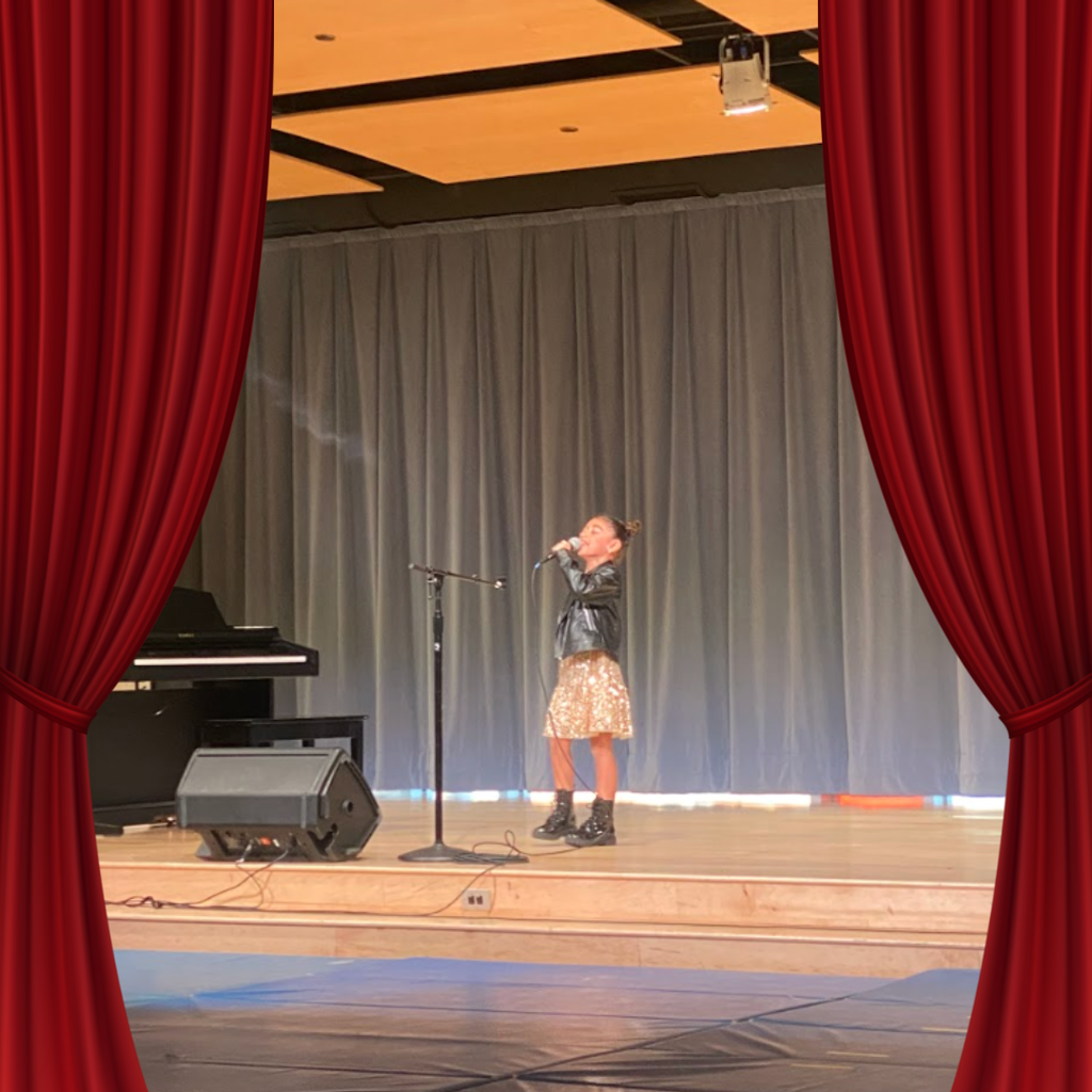 students on stage for talent show