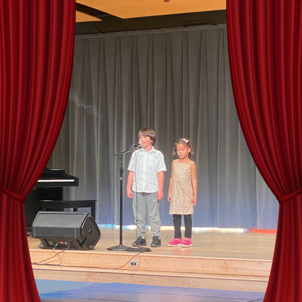 students on stage for talent show