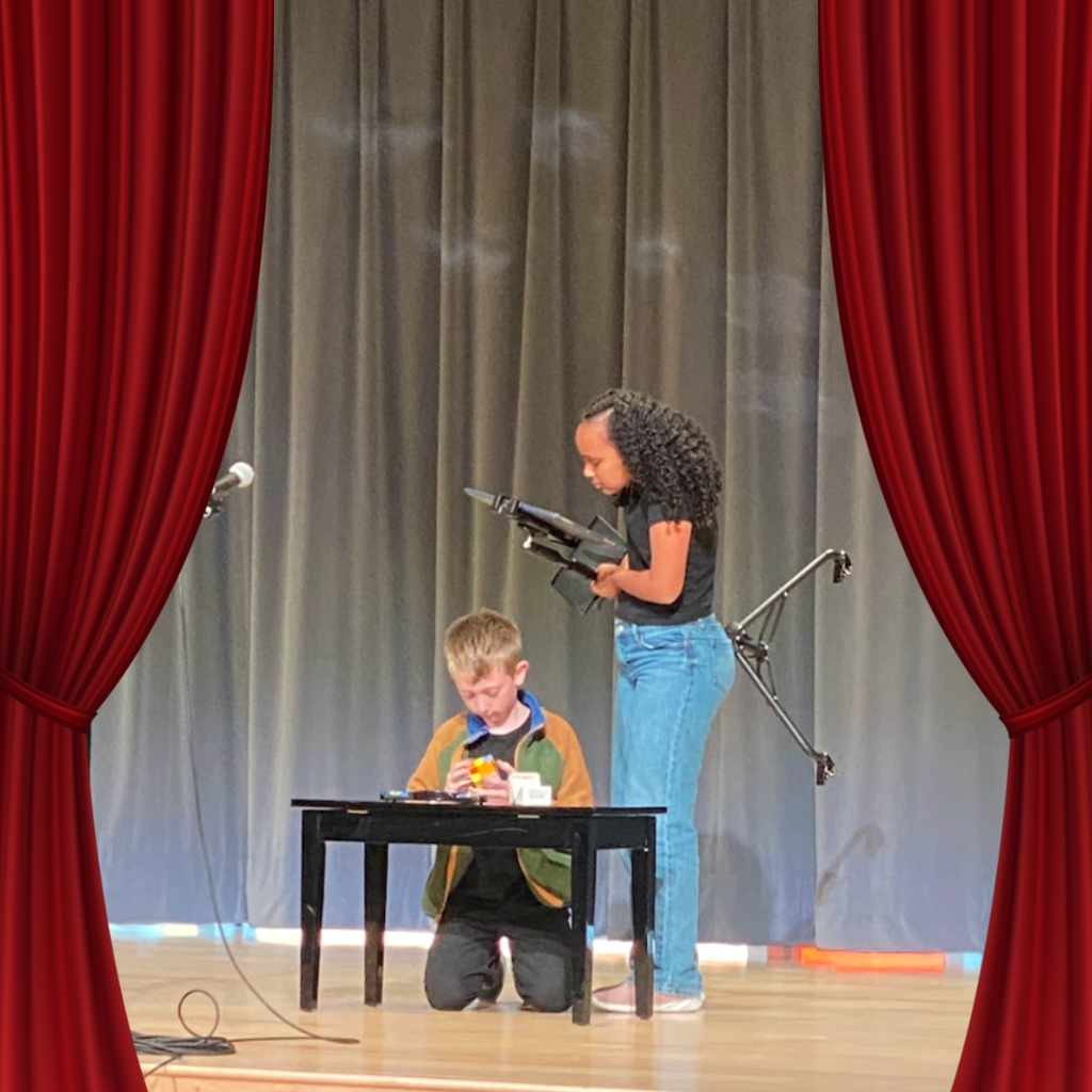 students on stage for talent show