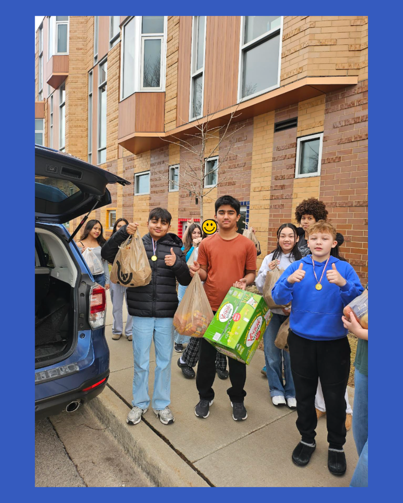 7th graders in food drive picture delivering food