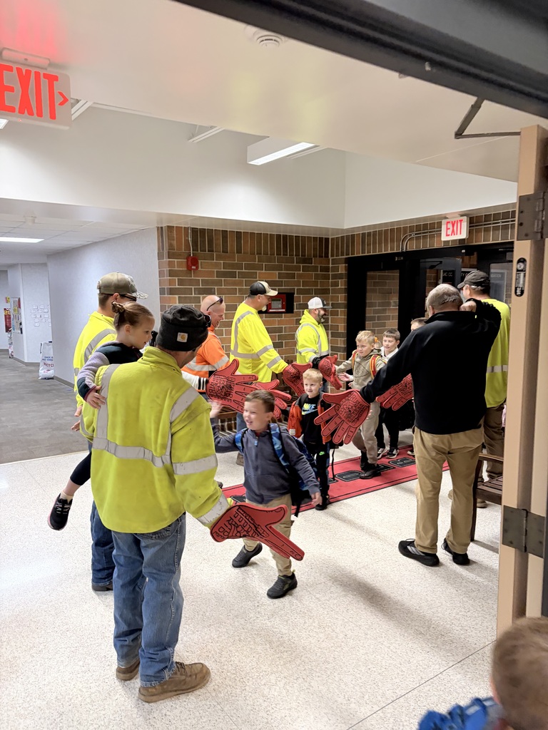 city of sac city greeting students high five friday
