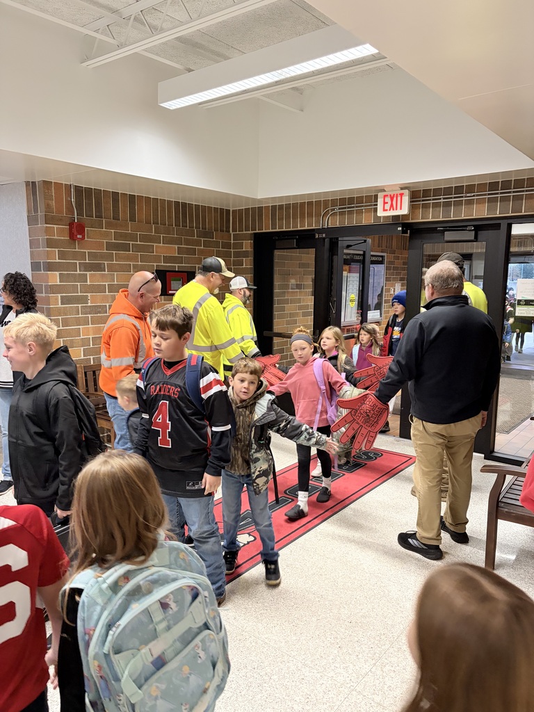 city of sac city greeting students high five friday