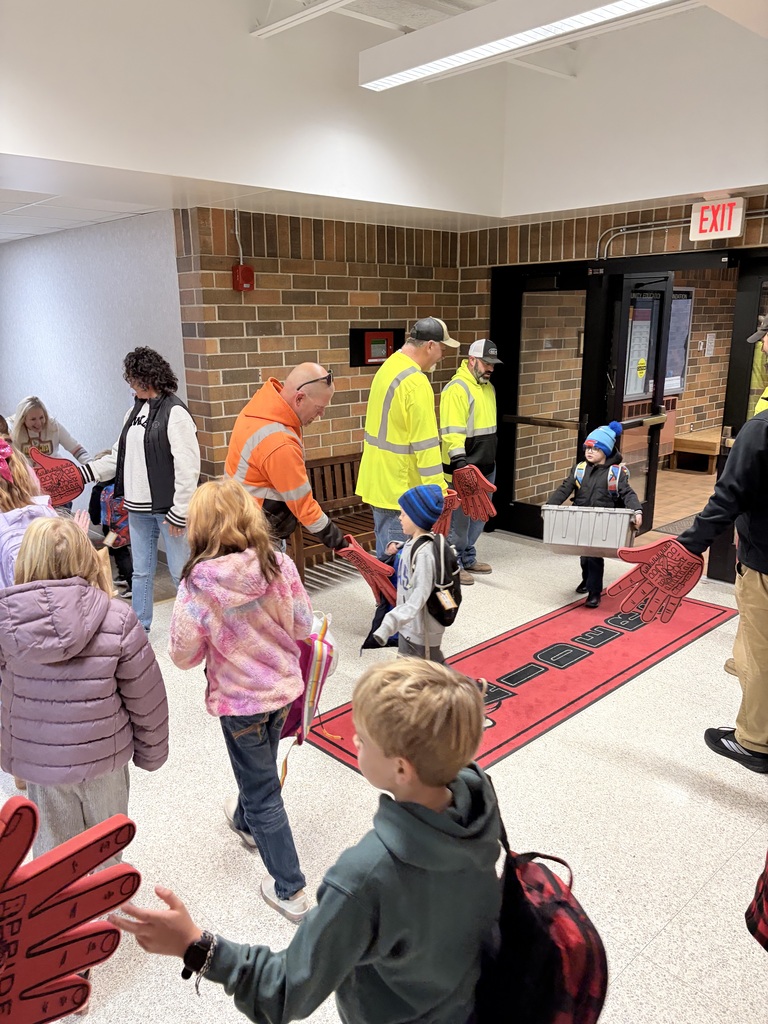 city of sac city greeting students high five friday