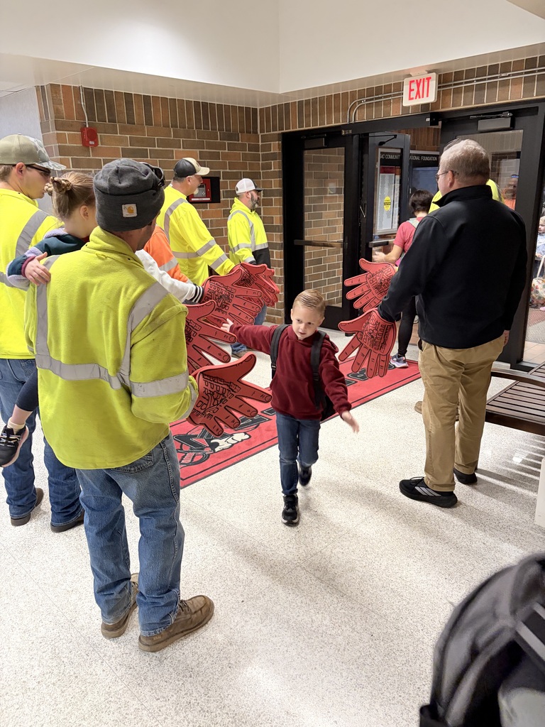city of sac city greeting students high five friday