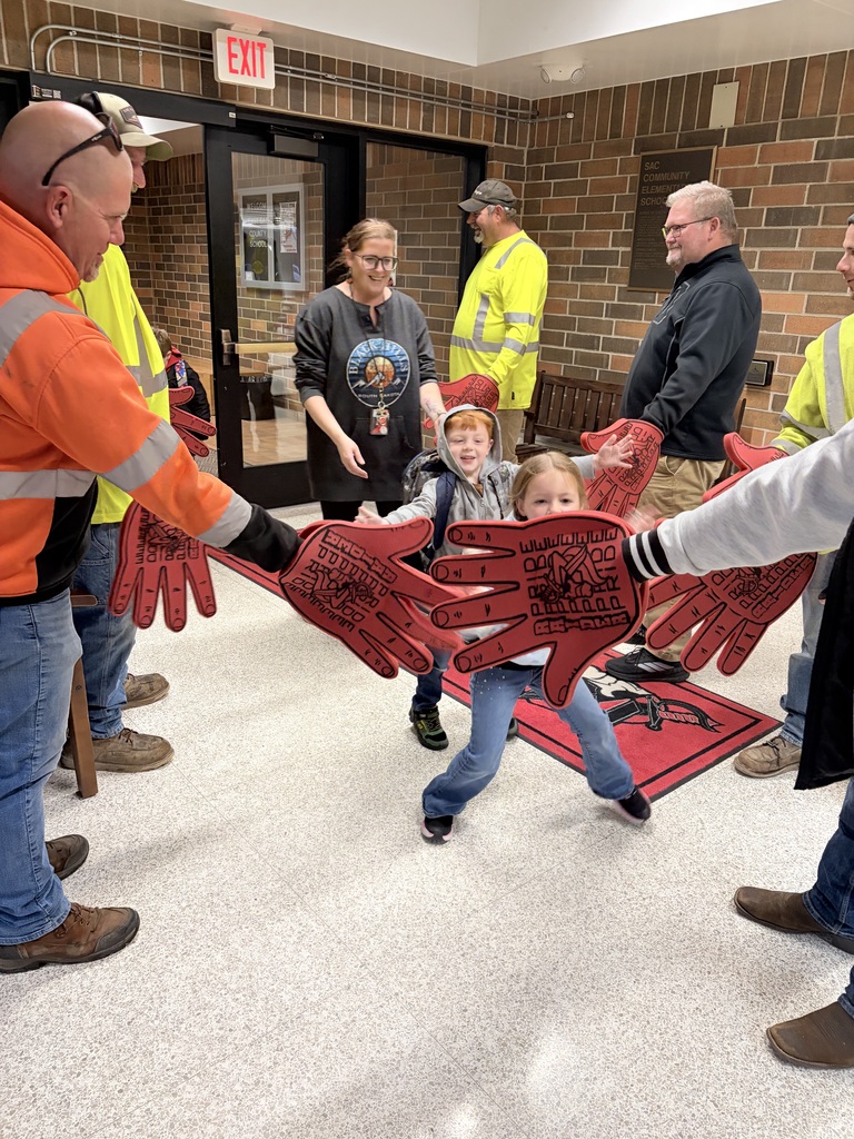 city of sac city greeting students high five friday