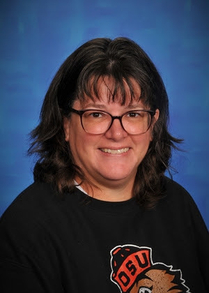 woman in front of a blue backdrop