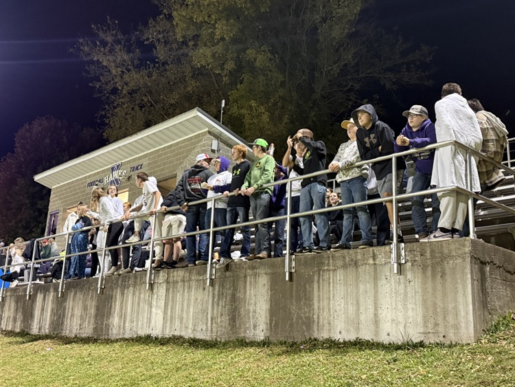 students cheering at a football game