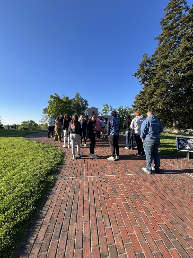 students walking on a brick path