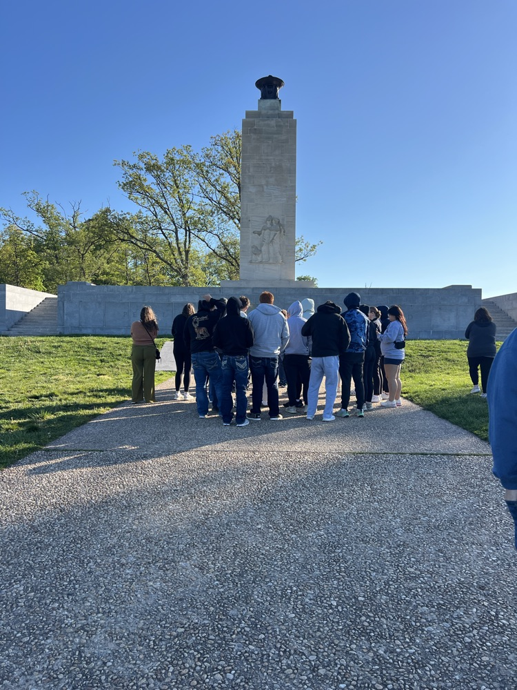students looking at a statue of Abe Lincoln