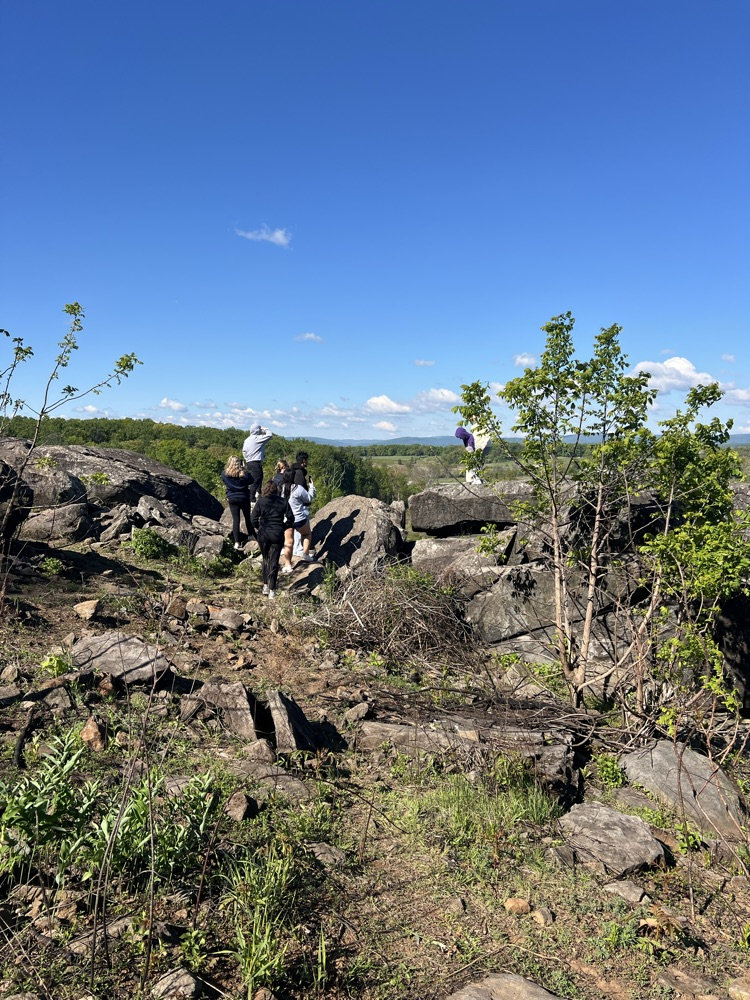 little round top with kids climbing rocks