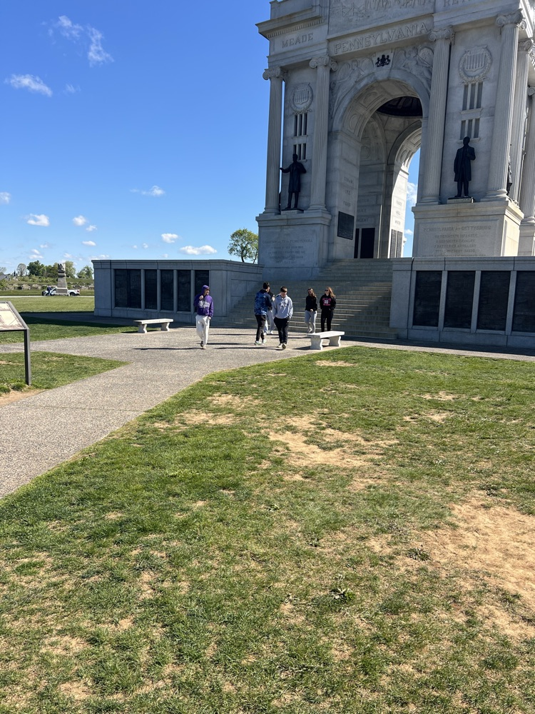 kids coming out of the concrete monument at Gettysburg