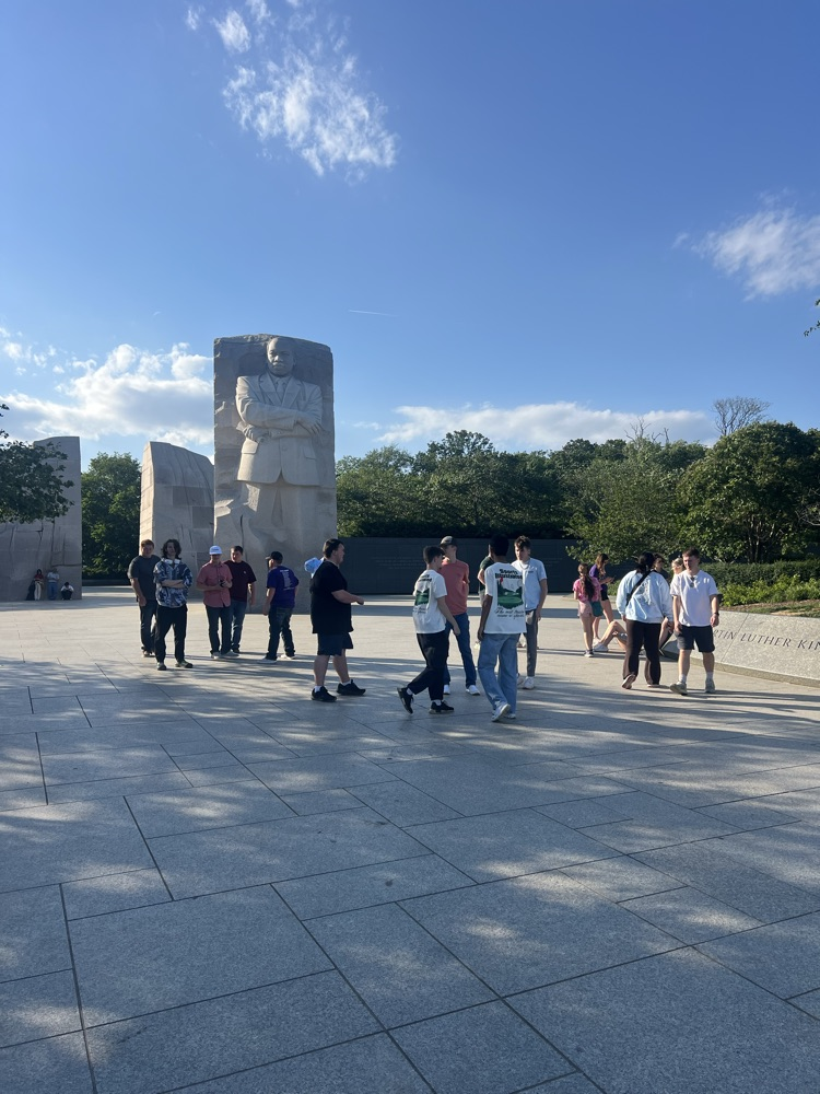 students walking. around at the Martin Luther King Jr memorial