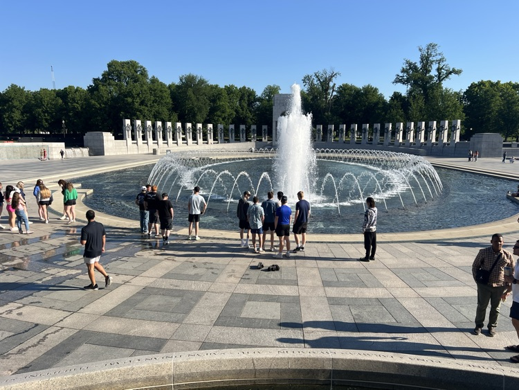 people at the WWII memorial in DC