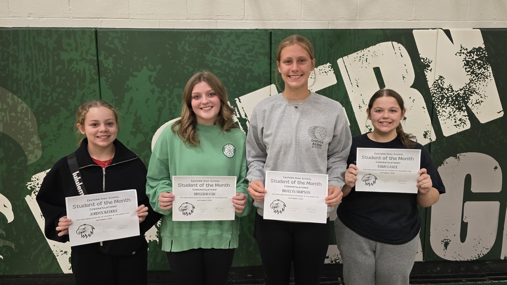 Student of The Month Winners Holding Certificates.