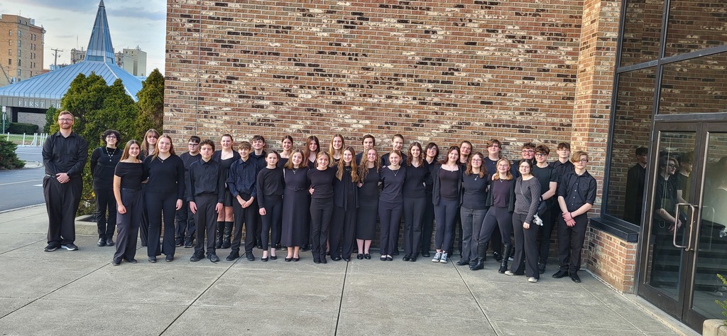 Eastern concert band students pictured outside after performing. Also pictured is Mr. Funke, Band Director. 