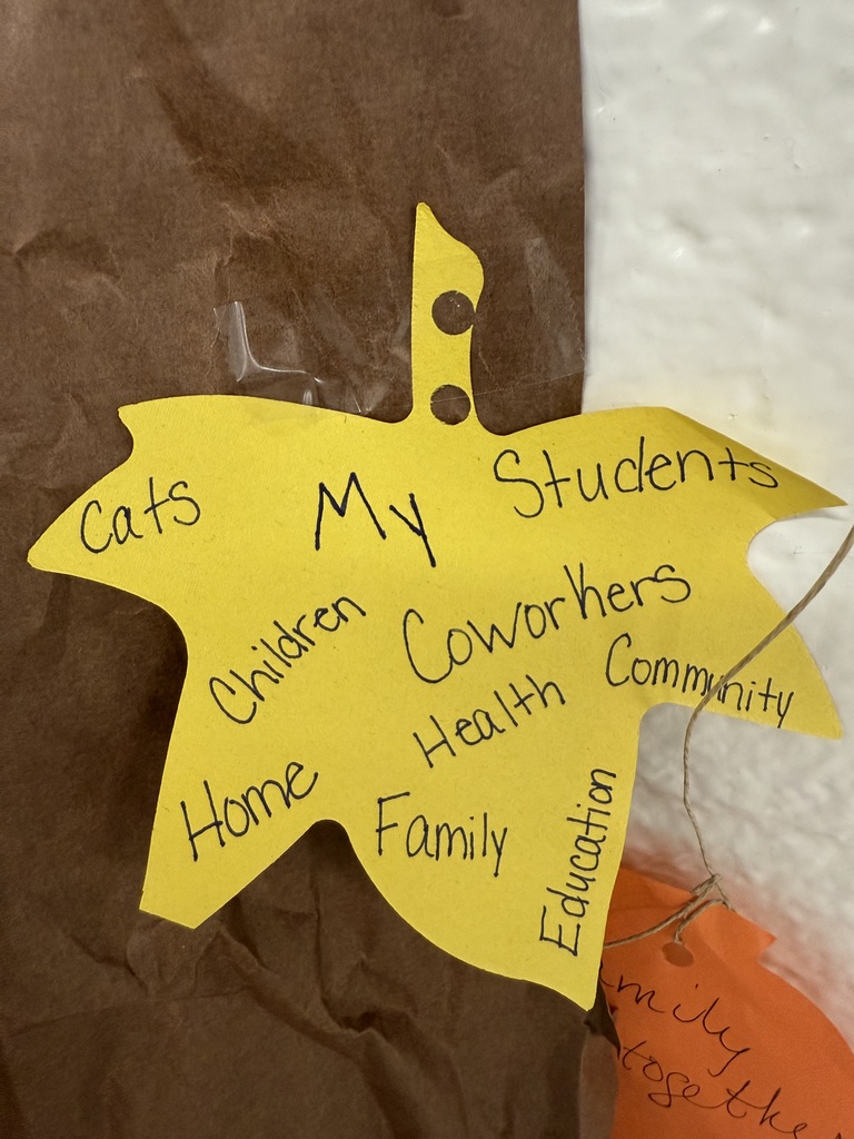 A yellow construction paper leaf. The handwriting reads: "Cats," "My Students," "Children," "Coworkers," "Health," "Community," "Home," "Family," "Education."