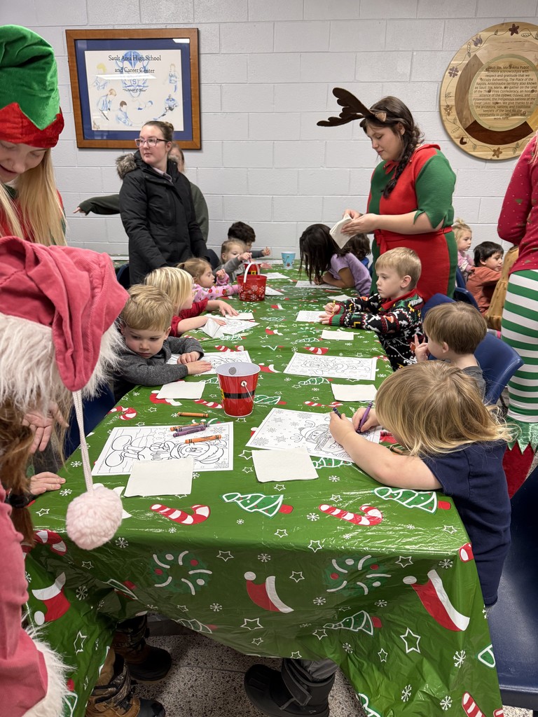 children coloring and eating cookies