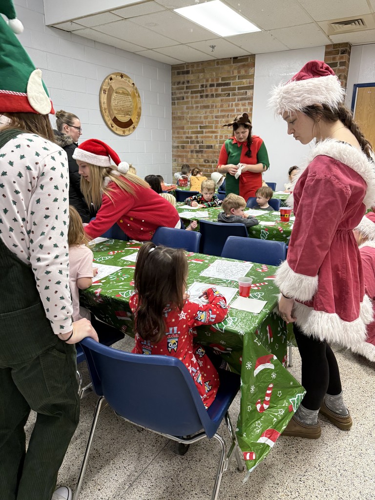 children coloring and eating cookies
