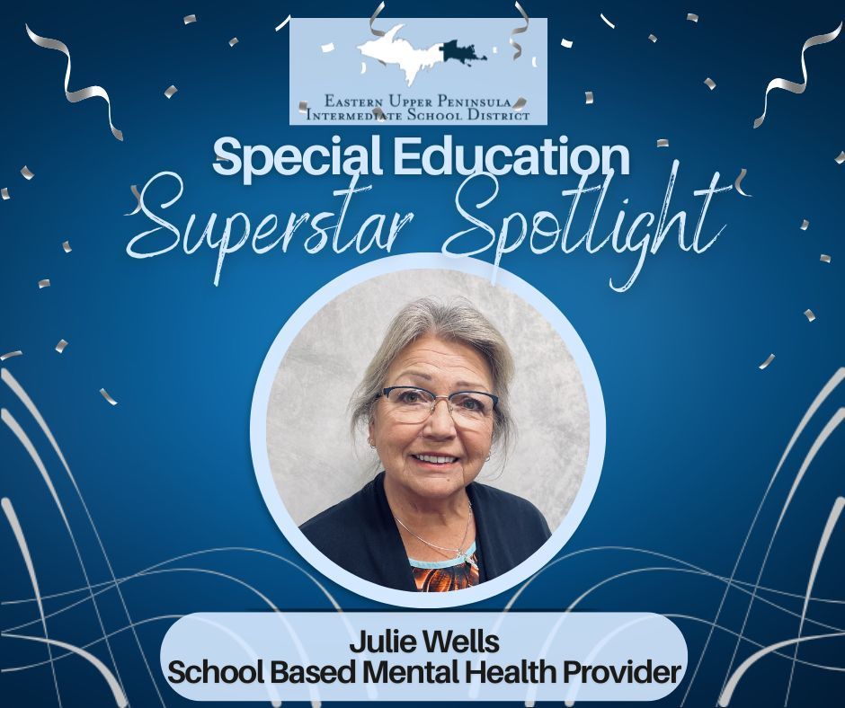 Headshot of a smiling woman with glasses. Celebratory graphic in the background, navy blue with silver confetti and the EUPISD logo.  Text says "Special  Education Superstar Spotlight. Julie Wells, School Based Mental Health Provider. "