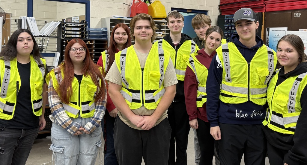 group of students in neon vests 